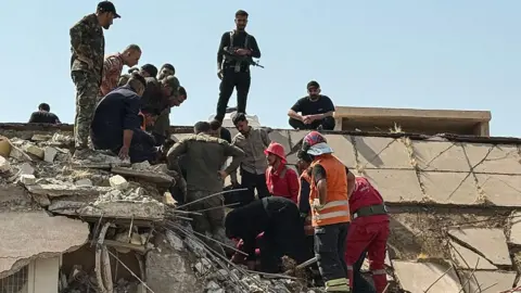 AFP Iraqi security forces and emergency personnel work at the site of a US-Saudi air strike north of Muqdadiyah district, in Iraq's Dayala province (29 July 2026)