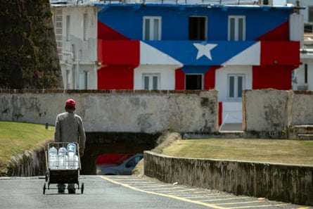 A man transports water containers