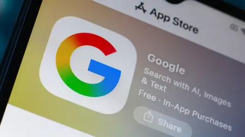 Getty Images The Google logo on a phone screen as it appears on the Apple App Store.
