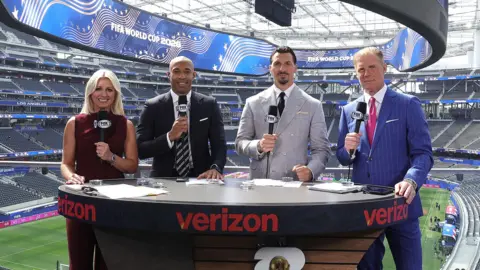 Getty Images Fox Sports presenter Rebecca Lowe alongside Thierry Henry, Zlatan Ibrahimović and Alexi Lalas at the Los Angeles Stadium, all holding microphones