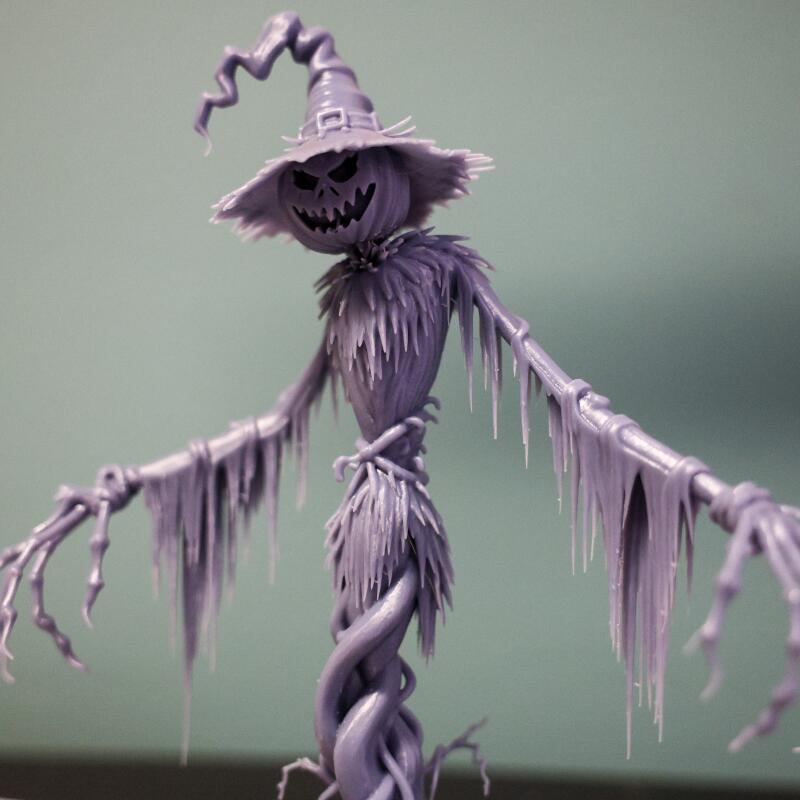 A sculpture resembling a witch, scarecrow and skeleton with spiral features