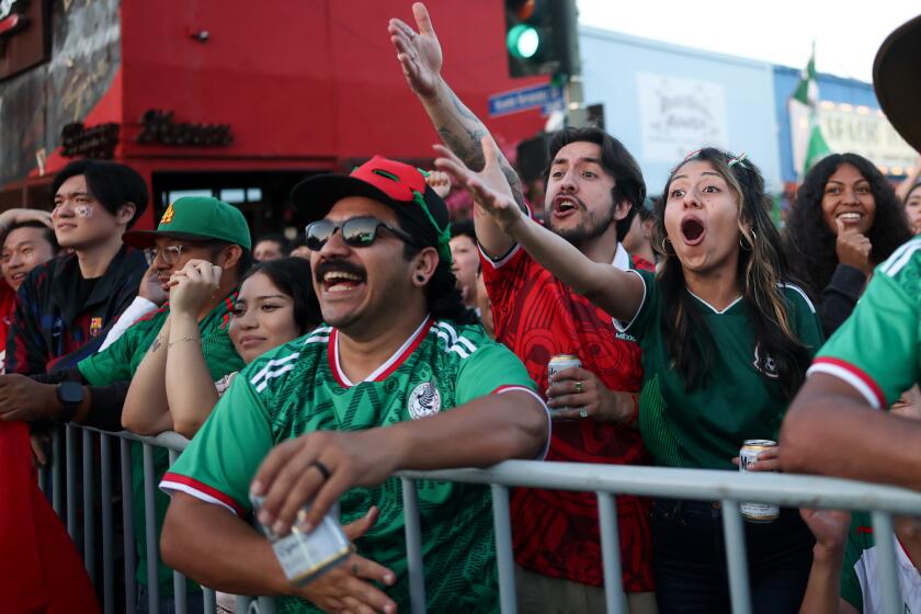 Los Angeles, CA, - June 18, 2026: Mexico fans react while watching a FIFA World Cup soccer Group A matchup between Mexico and South Korea in the Boyle Heights neighborhood on Thursday, June 18, 2026 in Los Angeles, CA. (Eric Thayer / Los Angeles Times)