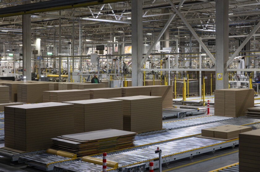 Automated machines build furniture components at Inno Line, a 538,000-square-foot production facility in Klaipėda, Lithuania, on April 22.