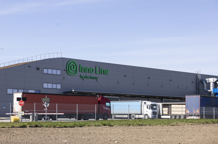Trucks pull into the Inno Line production facility in Klaipėda, Lithuania, on April 22.
