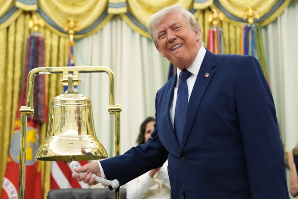 President Donald Trump rings the opening bell for the New York Stock Exchange and the Nasdaq in the Oval Office at the White House, Monday, July 6, 2026, in Washington. (AP Photo/Mark Schiefelbein)