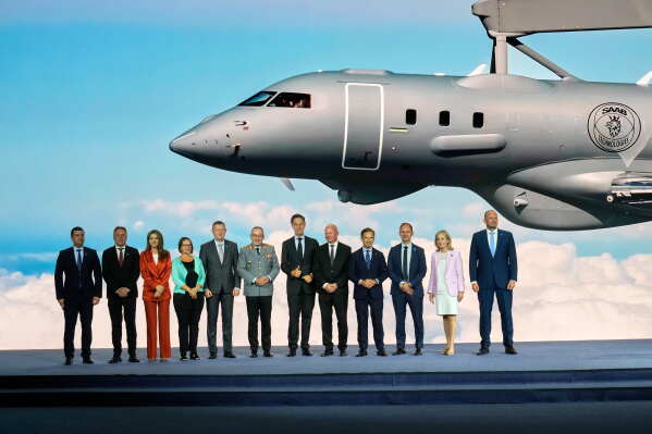 NATO Secretary General Mark Rutte, center, poses with NATO defense ministers and industry representatives during the opening of the NATO Defense Industry Forum on the sidelines of the NATO summit in Ankara, Turkey, Tuesday, July 7, 2026. (AP Photo/Hussein Malla)