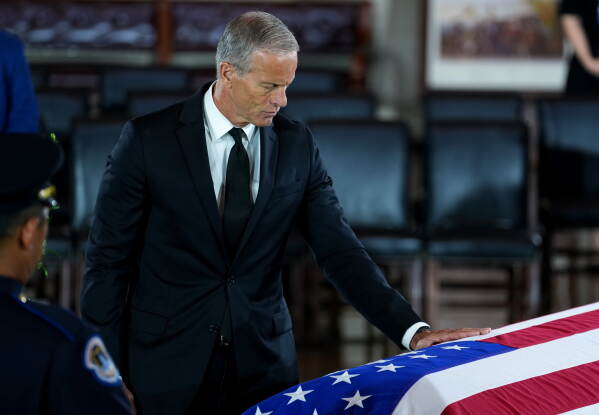 Sen. Majority Leader John Thune, R-S.D., pays his respects during a Congressional tribute to the late Sen. Lindsey Graham, R-S.C., in the Rotunda of the U.S. Capitol, Tuesday, July 28, 2026, in Washington. (AP Photo/Allison Robbert)