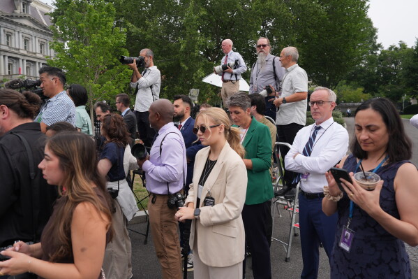 Journalists wait outside the West Wing of the White House to try and see the arrival of Ukraine's President Volodymyr Zelenskyy for a meeting with President Donald Trump, Tuesday, July 28, 2026, in Washington. (AP Photo/Alex Brandon)