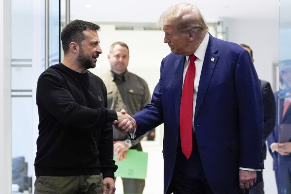 Republican presidential nominee former President Donald Trump, right, and Ukraine's President Volodymyr Zelenskyy shake hands during their meeting at Trump Tower, Sept. 27, 2024, in New York. (AP Photo/Julia Demaree Nikhinson, File)
