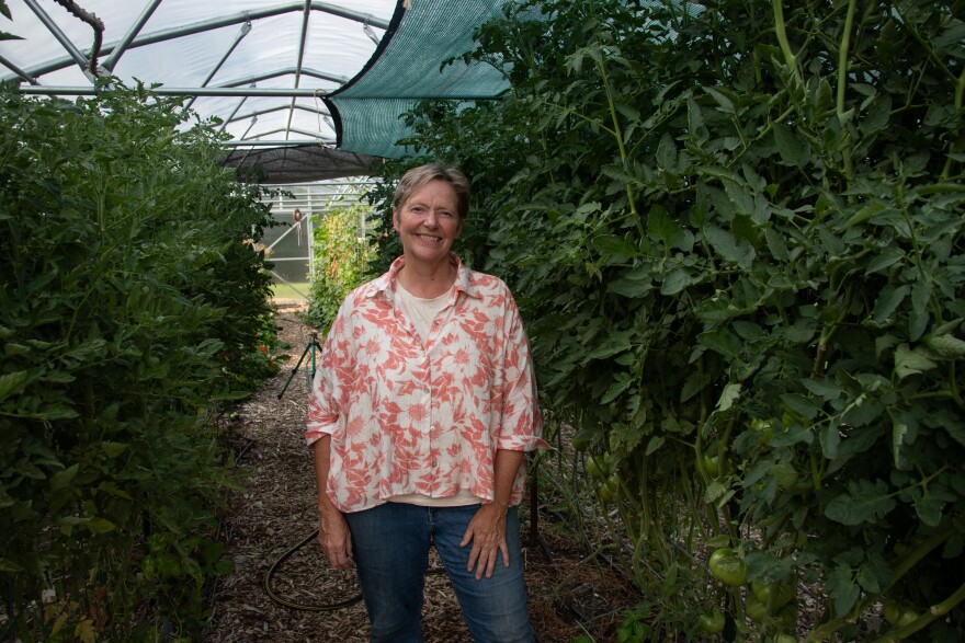 Alicia Ellingsworth stands in a greenhouse at the KC Farm School in Kansas City, Kansas.