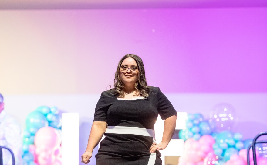 Chelsea Figueroa struts down the runway in her black and white dress and sparkling shoes. The look is inspired by late pop star Michael Jackson and his song "Black and White. "