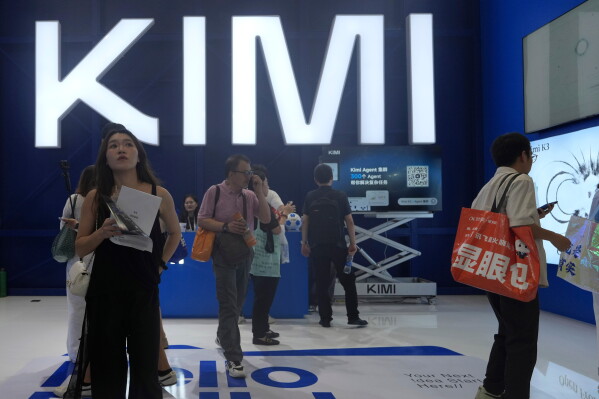 Visitors at the booth for Chinese AI Startup Moonshot's Kimi K3 during the World AI Conference in Shanghai, China on July 17, 2026. (AP Photo/Ng Han Guan)