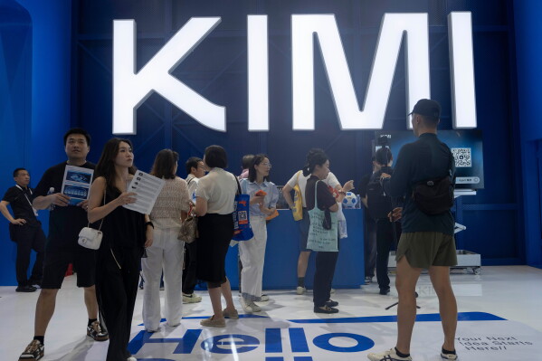 Visitors at the booth for Moonshot's Kimi K3 during World AI Conference in Shanghai, Friday, July 17, 2026. (AP Photo/Ng Han Guan)