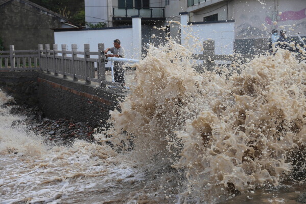 Huge waves crash on the coastline ahead of Typhoon Bavi in Wenling in eastern China's Zhejiang province, Friday, July 10, 2026. (Chinatopix Via AP) CHINA OUT
