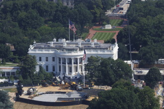 Construction workers continue designing a helipad for Marine One