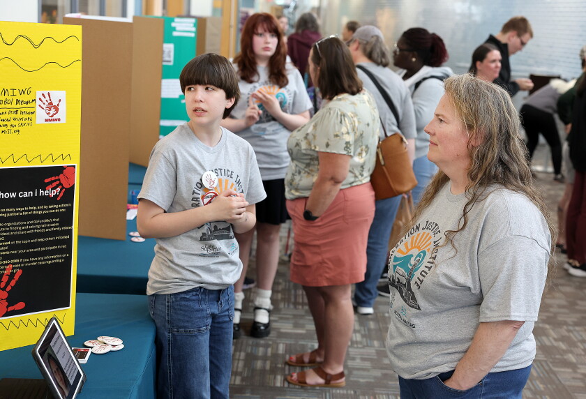 Student talks to instructor about project.