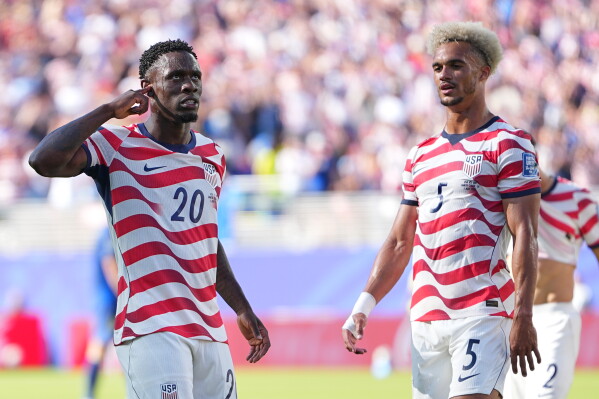 United States' Folarin Balogun (20) reacts after scoring his team's first goal during the World Cup round of 32 soccer match between the United States and Bosnia in Santa Clara, Calif., near San Francisco, Wednesday, July 1, 2026. (AP Photo/Julio Cortez)