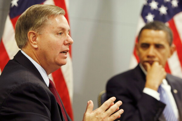 President-elect Barack Obama looks on as Sen. Lindsey Graham, R-S.C. discusses his recent trip to Afghanistan, Iraq, Kuwait and Pakistan, Jan. 14, 2009, at Obama's transition office in Washington. (AP Photo/Gerald Herbert, File)