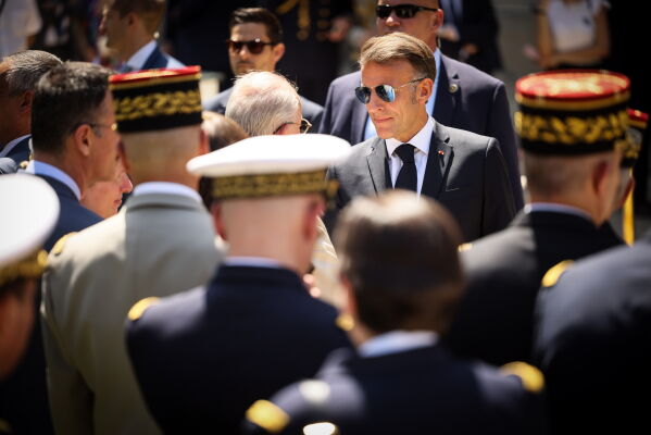 French President Emmanuel Macron greets senior military officers after his traditional address to the armed forces on the eve of the Bastille Day parade at the Ministry of Defense in Paris, Monday, July 13, 2026. (AP Photo/Thomas Padilla, Pool)