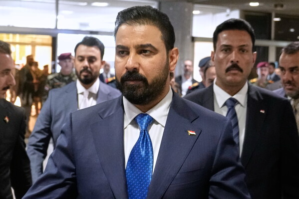 Iraq's Prime Minister-designate Ali al-Zaidi arrives at the Iraqi parliament to attend the voting of his government in Baghdad, Iraq, May 14, 2026. (AP Photo/Hadi Mizban, File)