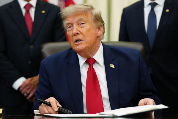 President Donald Trump speaks in the Oval Office of the White House, Monday, July 13, 2026, in Washington, as he signs executive orders. (AP Photo/Julia Demaree Nikhinson)