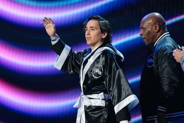Host Marcello Hernández, left, walks out with Mike Tyson at the ESPY Awards in the David H. Koch Theater at Lincoln Center Wednesday, July 15, 2026, in New York. (AP Photo/Frank Franklin II)