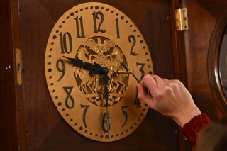 Bethany Gill winds a clock in the Pennsylvania Supreme Court chamber, Dec. 13, 2024, in Harrisburg, Pa. (AP Photo/Marc Levy, File)