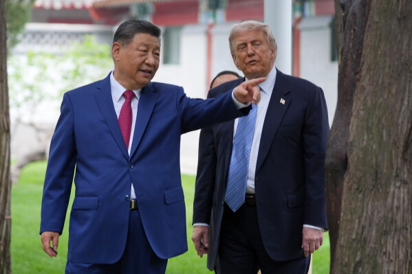 President Donald Trump talks with China's President Xi Jinping at the Zhongnanhai leadership compound, May 15, 2026, in Beijing. (AP Photo/Mark Schiefelbein, Pool, File)