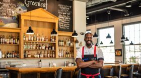 Chris Viaud poses inside one of his restaurants, Greenleaf, in Milford.