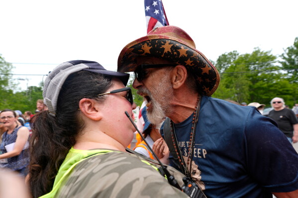 A counter protester yells at a volunteer providing security during a demonstration near a U.S. Immigration and Customs Enforcement facility in Scarborough, Maine, Tuesday, July 14, 2026, one day after the shooting of Johan Sebastián Durán Guerrero. (AP Photo/Robert F. Bukaty)