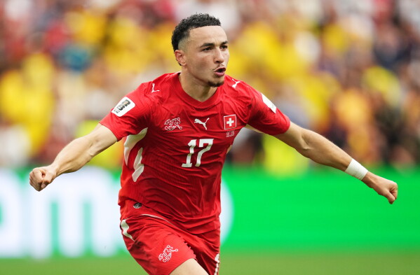 Switzerland's Ruben Vargas (17) celebrates after making the winning kick in a penalty shootout in the World Cup round of 16 soccer match between Switzerland and Colombia in Vancouver, British Columbia, Tuesday, July 7, 2026. (Ethan Cairns/The Canadian Press via AP)