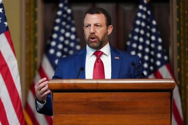 Homeland Security Secretary Markwayne Mullin speaks in the Indian Treaty Room at the Eisenhower Executive Office Building on the White House campus, Friday, July 17, 2026, in Washington. (AP Photo/Julia Demaree Nikhinson)