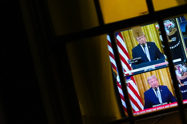 President Donald Trump is seen speaking from the East Room on a television in the West Wing of the White House, Thursday, July 16, 2026, in Washington. (AP Photo/Julia Demaree Nikhinson)