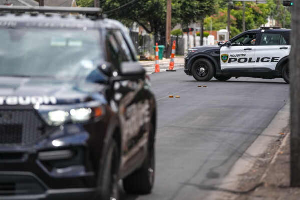 Police work on Canal Street in Houston, Tuesday, July 7, 2026, after a shooting. (Jacob Lujan/Houston Chronicle via AP)