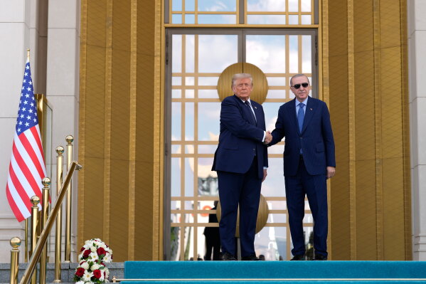 President Donald Trump, left, shakes hands with Turkish President Recep Tayyip Erdogan as he arrives at the Bestepe Presidential Palace during a formal welcome for the NATO summit in Ankara, Turkey, Tuesday, July 7, 2026. (AP Photo/Emrah Gurel, Pool)