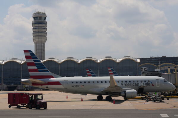 An American Eagle plane is parked at a gate at the Ronald Reagan Washington National Airport in Arlington, Va., June 29, 2026. (AP Photo/Carolyn Kaster, File)