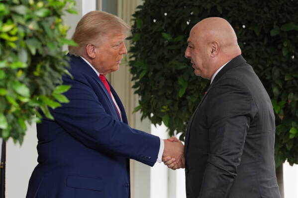 President Donald Trump greets Lebanese President Joseph Aoun on his arrival at the White House, Tuesday, July 21, 2026, in Washington. (AP Photo/Mark Schiefelbein)