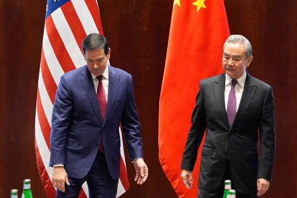FILE - U.S. Secretary of State Marco Rubio meets China's Foreign Minister Wang Yi in Munich, Germany, Friday, Feb. 13, 2026, on the sidelines of the Munich Security Conference. (AP Photo/Alex Brandon, Pool)