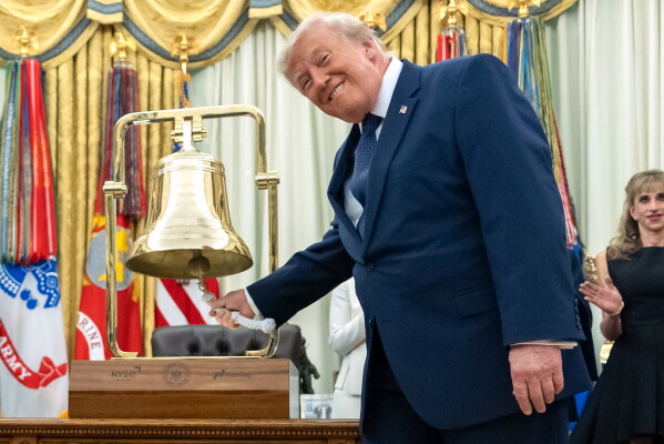 President Donald Trump rings the opening bell for the New York Stock Exchange and the Nasdaq in the Oval Office at the White House, Monday, July 6, 2026, in Washington. (AP Photo/Mark Schiefelbein)