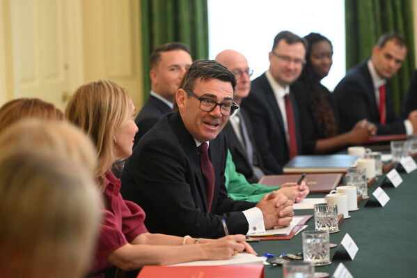 Britain's Prime Minister Andy Burnham, center, attends his first cabinet meeting as prime minister at 10 Downing Street, London, Tuesday July 21, 2026. (Eddie Mulholland/Pool Photo via AP)