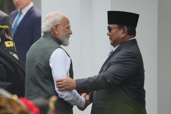 India's Prime Minister Narendra Modi, left, is greeted by Indonesia's President Prabowo Subianto during the welcoming ceremony ahead of their meeting at Merdeka Palace in Jakarta, Indonesia, Tuesday, July 7, 2026. (AP Photo/Achmad Ibrahim)