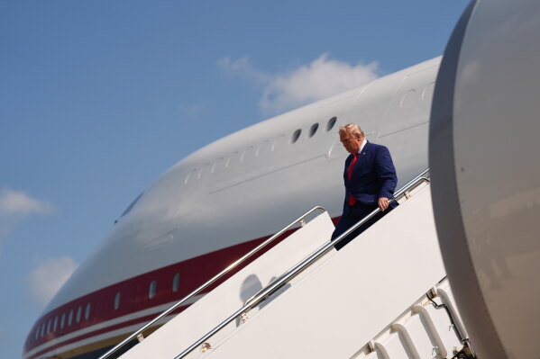 President Donald Trump disembarks Air Force One, Wednesday, July 22, 2026, at Dover Air Force Base, Del. (AP Photo/Julia Demaree Nikhinson)