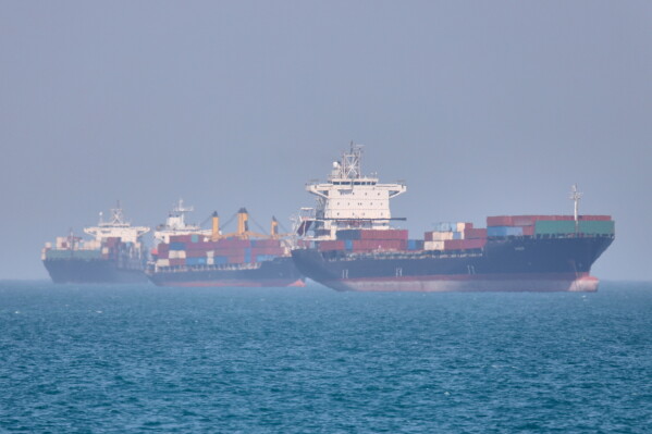 Container ships sit at anchor in the Strait of Hormuz off Bandar Abbas, Iran, Saturday, May 2, 2026.(Amirhosein Khorgooi/ISNA via AP)