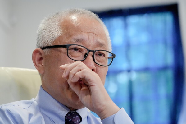Chinese pastor Ezra Jin Mingri becomes emotional during an interview with The Associated Press in Maryland, Wednesday, July 22, 2026 . (AP Photo/Mariam Zuhaib)