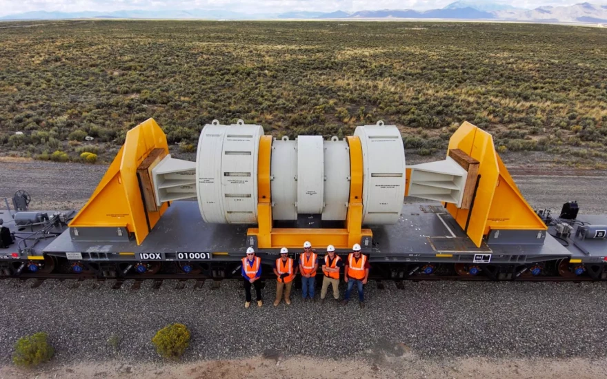 Workers pose with a new train car designed to carry highly-radioactive nuclear waste from power plants around the country.