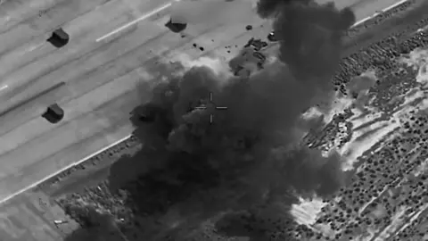 CENTCOM A black and white thermal imagery screengrab showing a US strike on a target in Iran.