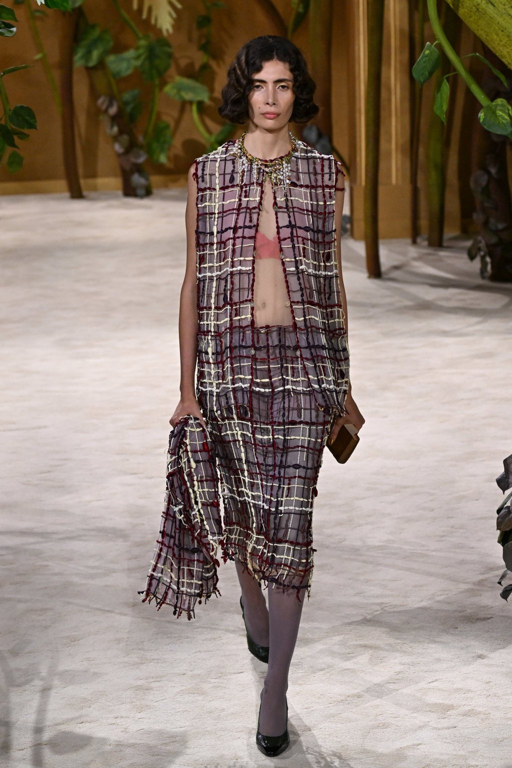 Chanel’s opening look was a new take on the maison’s classic tweed suit. Photo: AP