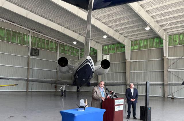 Rep. Jose Alvarez and City of Kissimmee Director of Aviation Shawn Germolus with a component of the ALTA system at Signature Aviation at Tuesday’s event. (Photo/Terry Lloyd)