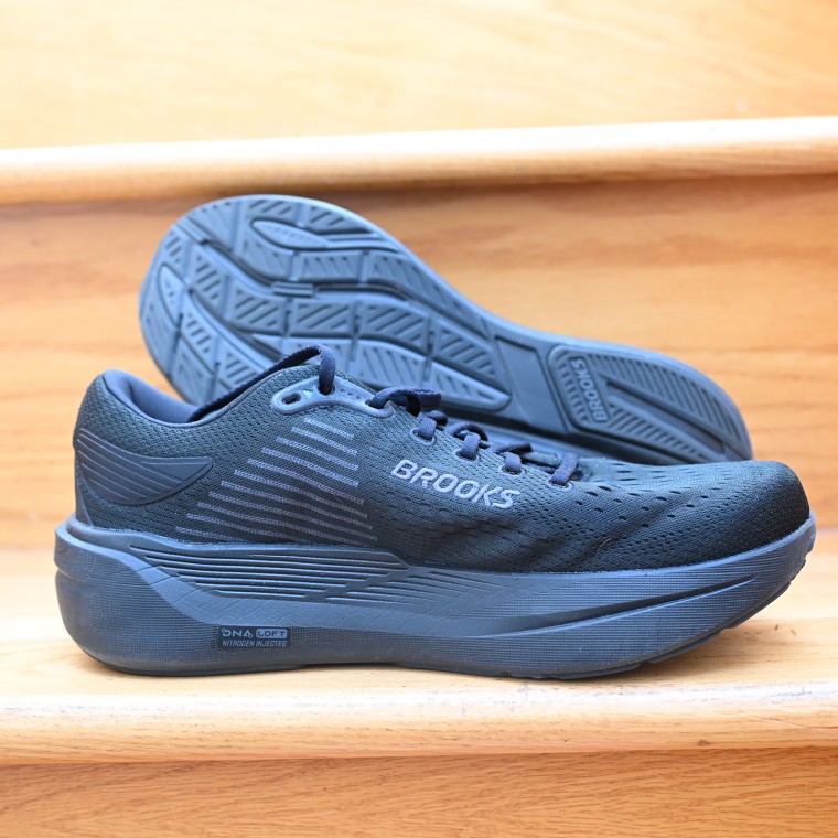 A close-up of the Brooks Ghost Max 3 resting against a wooden stair.