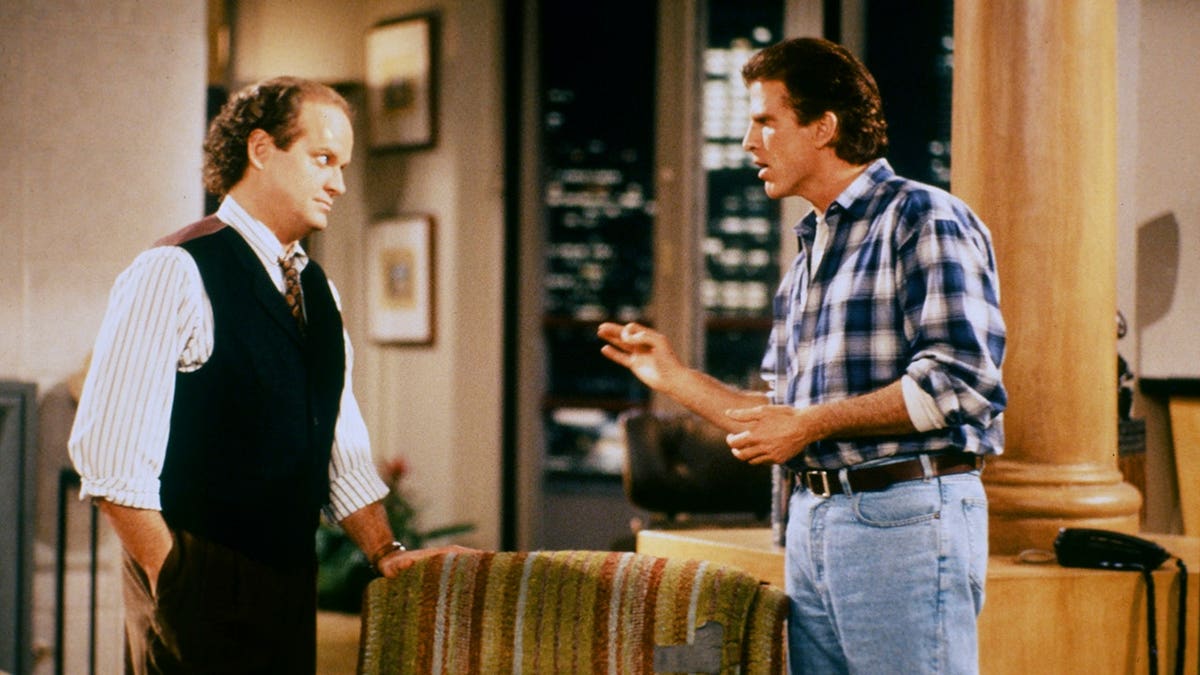 Kelsey Grammer as Frasier Crane and Ted Danson as Sam Malone stand together.